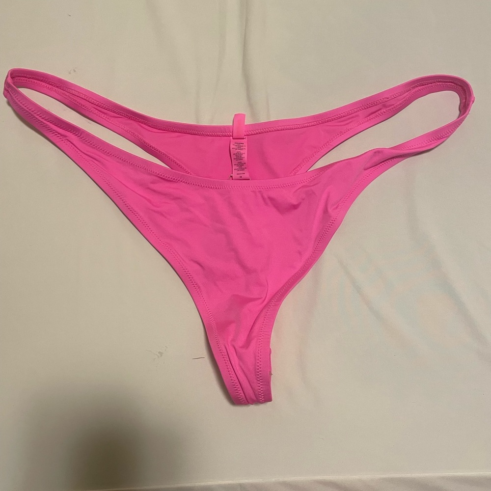 Skims Signature Swim Thong Bottoms in Taffy (pink, 3X)